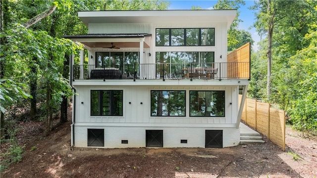 6178 Lake Lanier Height Rd, Buford, GA 30518 - rear view of property with a balcony, crawl space, board and batten siding, and a ceiling fan