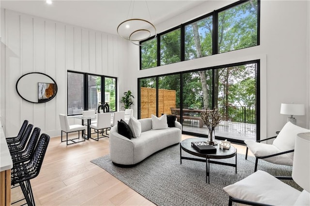 6178 Lake Lanier Height Rd, Buford, GA 30518 - living area with a towering ceiling, light wood-style flooring, and recessed lighting