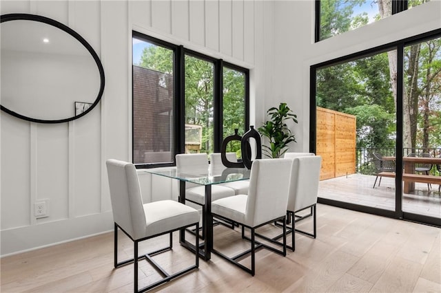 6178 Lake Lanier Height Rd, Buford, GA 30518 - dining space featuring a decorative wall and light wood-type flooring