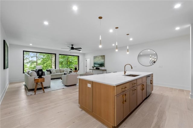 6178 Lake Lanier Height Rd, Buford, GA 30518 - kitchen with stainless steel dishwasher, recessed lighting, a center island with sink, light wood-type flooring, and ceiling fan