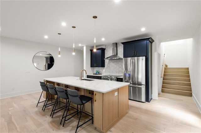 6178 Lake Lanier Height Rd, Buford, GA 30518 - kitchen with wall chimney exhaust hood, stainless steel refrigerator with ice dispenser, decorative backsplash, a kitchen breakfast bar, and a kitchen island with sink