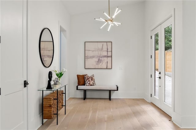 6178 Lake Lanier Height Rd, Buford, GA 30518 - foyer entrance featuring french doors, a chandelier, and light wood finished floors