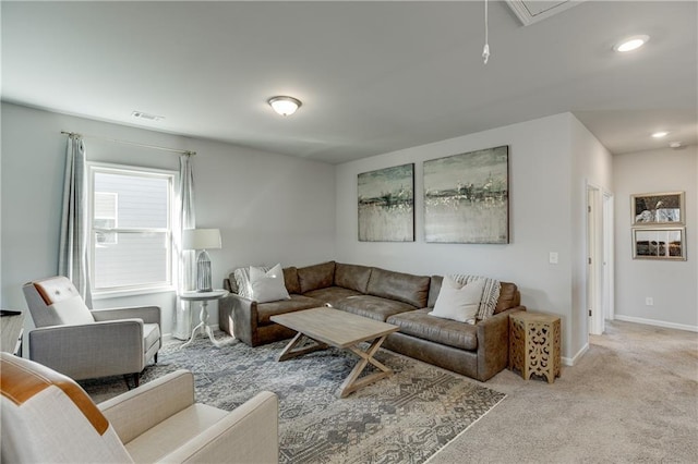 living area with carpet flooring, attic access, baseboards, and recessed lighting