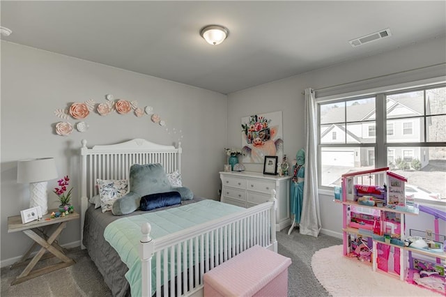 bedroom featuring light colored carpet and baseboards