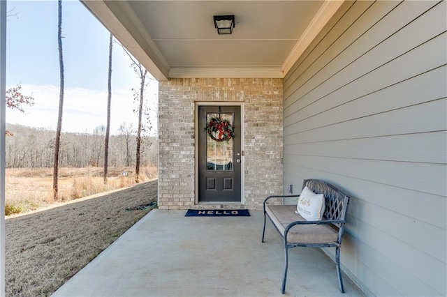 entrance to property with brick siding