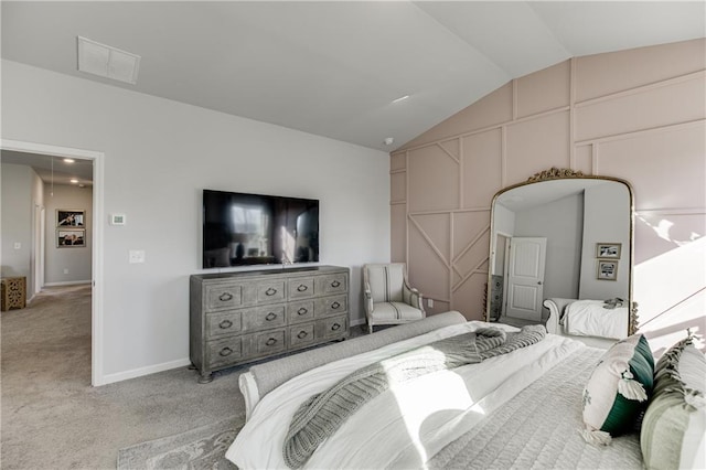 carpeted bedroom featuring lofted ceiling