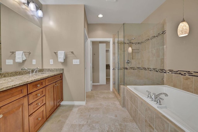 bathroom featuring tile patterned flooring, vanity, and separate shower and tub