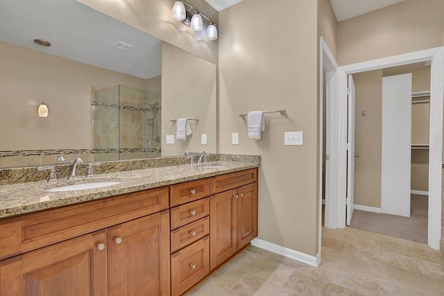 bathroom with vanity and an enclosed shower