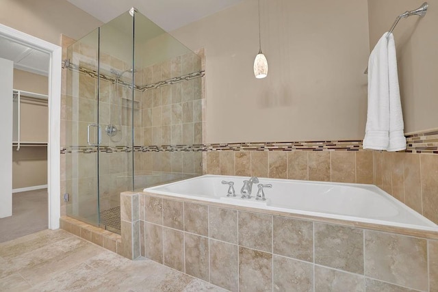 bathroom with separate shower and tub