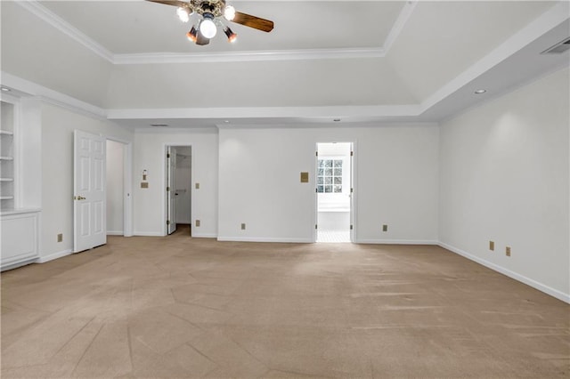 interior space featuring visible vents, a raised ceiling, light colored carpet, and ceiling fan