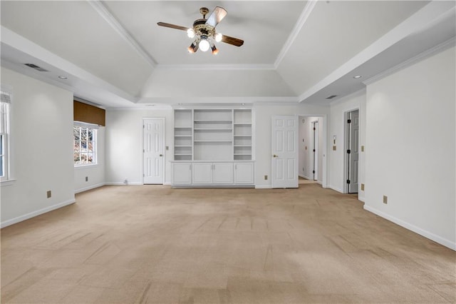 unfurnished living room with baseboards, a raised ceiling, ceiling fan, and ornamental molding