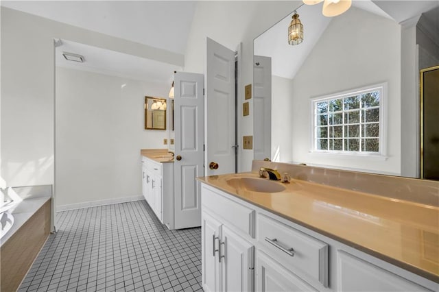 bathroom featuring baseboards, lofted ceiling, a bath, tile patterned floors, and vanity