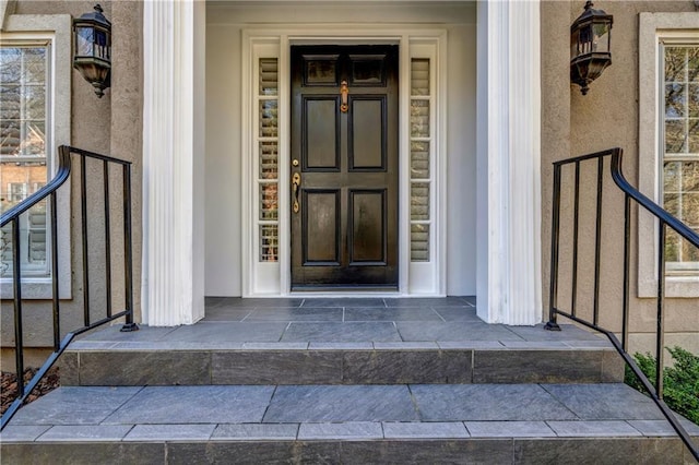 view of exterior entry featuring a porch