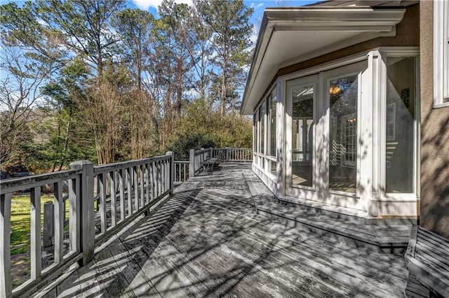 deck with a sunroom