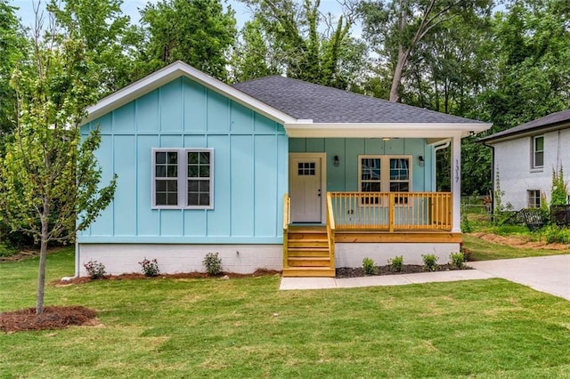 1317 Bernard St NW, Atlanta, GA 30314 - bungalow-style house featuring board and batten siding, a shingled roof, covered porch, and a front lawn