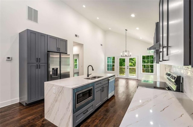 1317 Bernard St NW, Atlanta, GA 30314 - kitchen with a sink, appliances with stainless steel finishes, french doors, light stone counters, and high vaulted ceiling