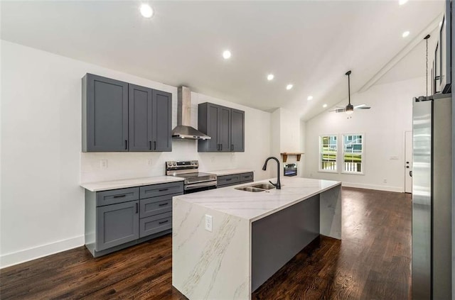 1317 Bernard St NW, Atlanta, GA 30314 - kitchen with wall chimney range hood, appliances with stainless steel finishes, a sink, light stone countertops, and gray cabinets