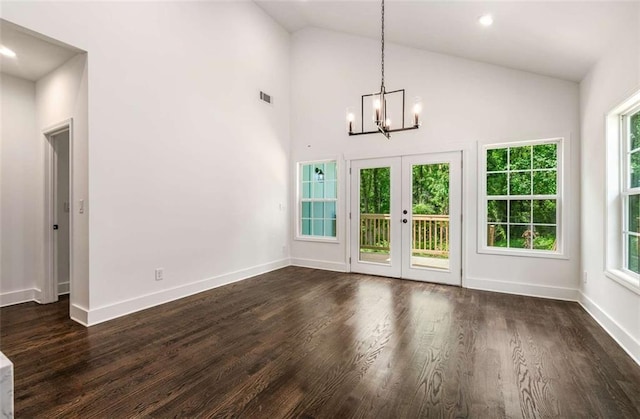 1317 Bernard St NW, Atlanta, GA 30314 - unfurnished dining area with a chandelier, dark wood-type flooring, plenty of natural light, french doors, and high vaulted ceiling