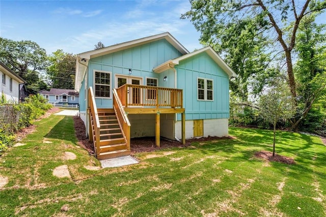1317 Bernard St NW, Atlanta, GA 30314 - rear view of property featuring stairs, a deck, board and batten siding, and a yard