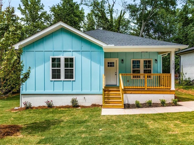 1317 Bernard St NW, Atlanta, GA 30314 - view of front of property featuring roof with shingles, board and batten siding, a porch, and a front lawn