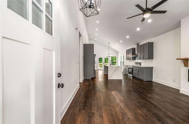 1317 Bernard St NW, Atlanta, GA 30314 - living room featuring high vaulted ceiling, a chandelier, dark wood-style floors, baseboards, and ceiling fan