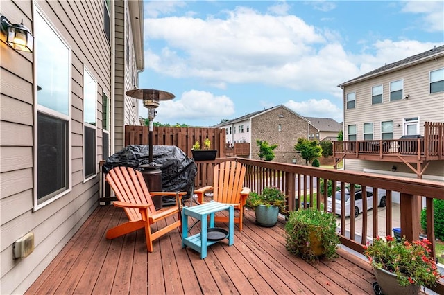 wooden terrace featuring grilling area