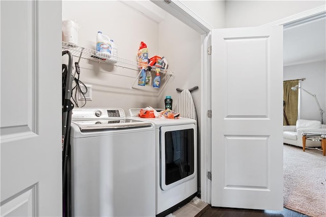 laundry room featuring separate washer and dryer and dark carpet