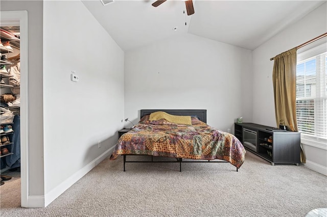 bedroom with multiple windows, vaulted ceiling, carpet floors, and ceiling fan