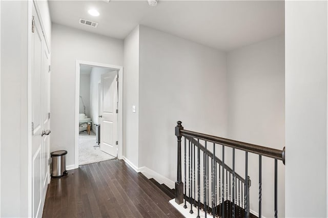 hall featuring dark wood-type flooring