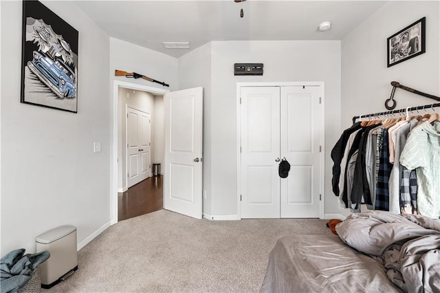 interior space featuring light colored carpet and a barn door