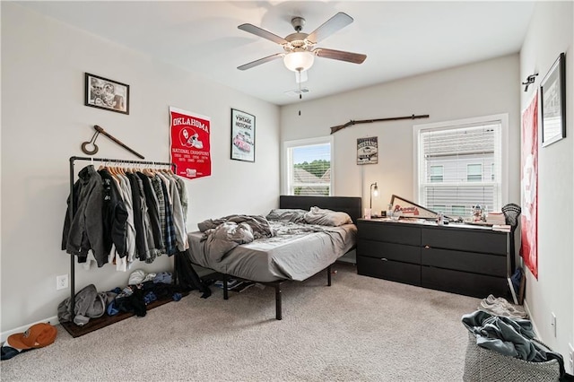 carpeted bedroom featuring ceiling fan