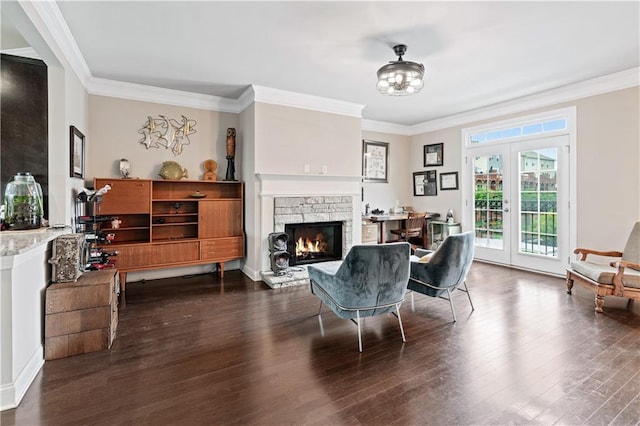 living area with ornamental molding, dark hardwood / wood-style floors, and french doors