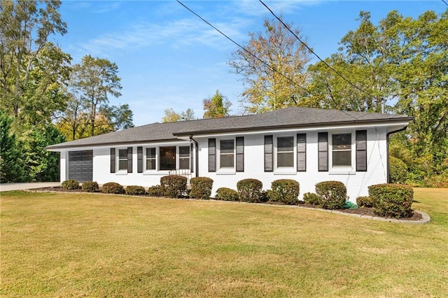 ranch-style home featuring a front yard