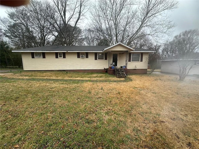 single story home featuring a front yard