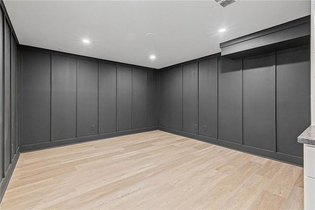 12995 Bucksport Dr, Roswell, GA 30075 - spare room featuring a decorative wall, light wood-type flooring, and recessed lighting