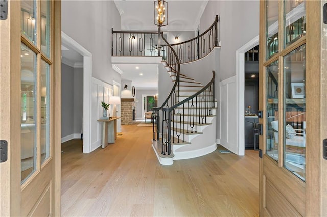 12995 Bucksport Dr, Roswell, GA 30075 - foyer with a high ceiling, stairway, crown molding, wood finished floors, and baseboards