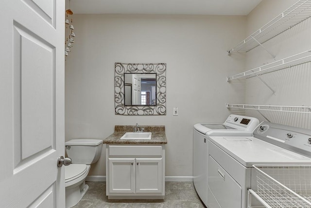 laundry room with sink and washing machine and clothes dryer