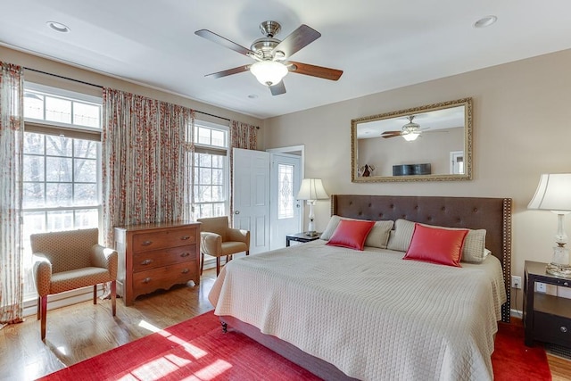 bedroom featuring wood-type flooring and ceiling fan