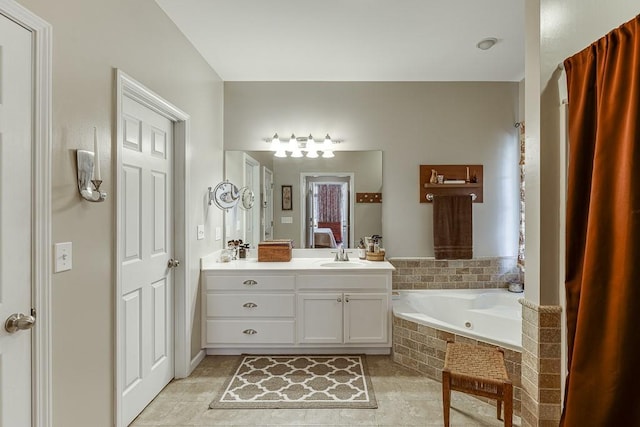 bathroom featuring vanity, tiled tub, and tile patterned flooring