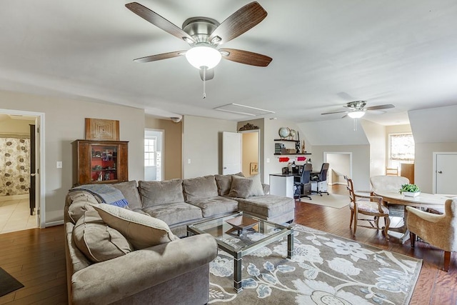 living room with wood-type flooring and ceiling fan