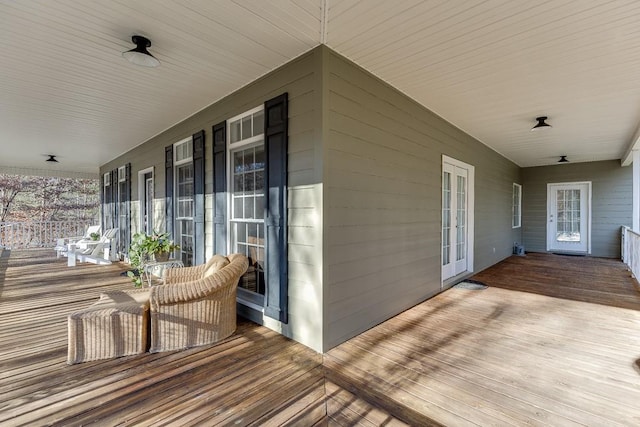 wooden terrace with a porch