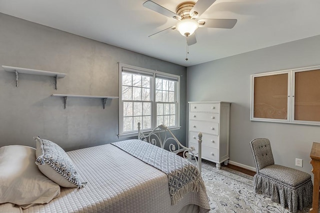 bedroom with ceiling fan and light wood-type flooring