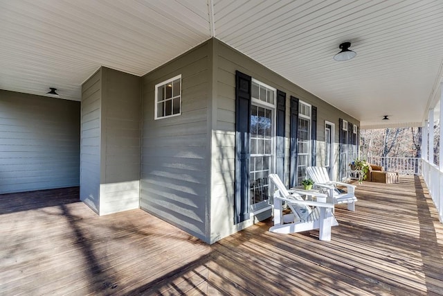 wooden terrace featuring a porch