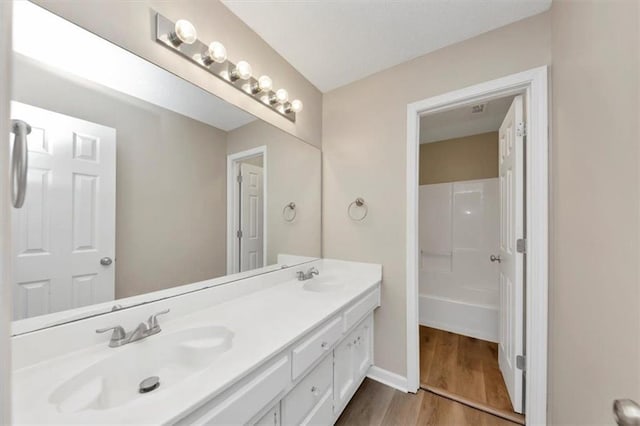 bathroom featuring vanity and wood-type flooring