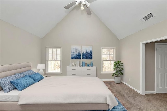 bedroom with multiple windows, ceiling fan, carpet floors, and high vaulted ceiling