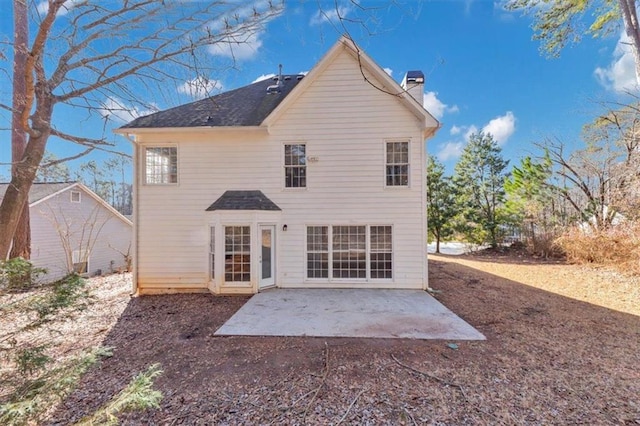 rear view of property featuring a patio area