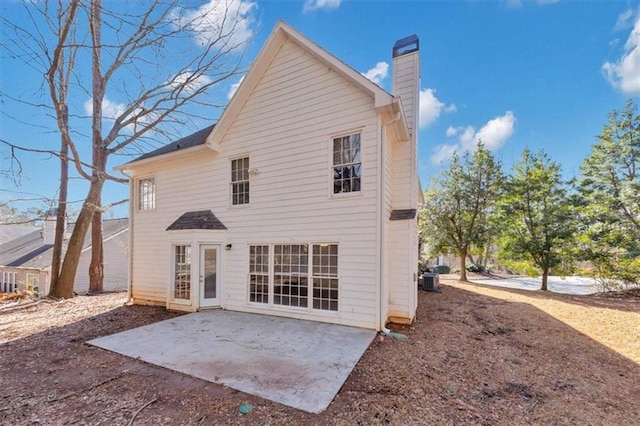 back of house featuring a patio and central air condition unit