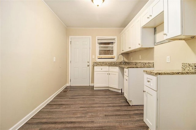 1907 Oak Valley Rd, Decatur, GA 30035 - kitchen featuring baseboards, white cabinetry, light stone countertops, and dark wood-style floors