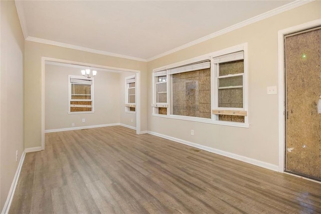 1907 Oak Valley Rd, Decatur, GA 30035 - spare room featuring wood finished floors, baseboards, a chandelier, and ornamental molding