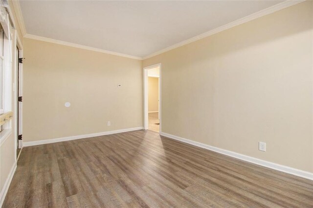 1907 Oak Valley Rd, Decatur, GA 30035 - spare room with baseboards, ornamental molding, and wood finished floors